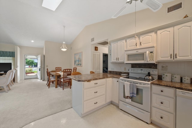 kitchen featuring visible vents, white cabinetry, pendant lighting, white appliances, and dark countertops