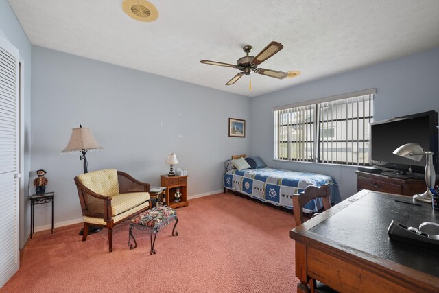bedroom featuring baseboards, a ceiling fan, and carpet