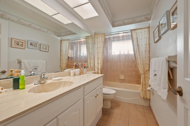 bathroom with shower / bath combo, a skylight, toilet, vanity, and tile patterned floors