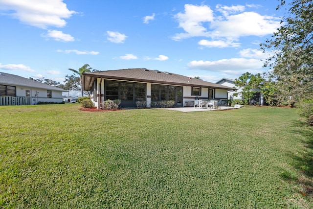 back of house with a patio and a yard