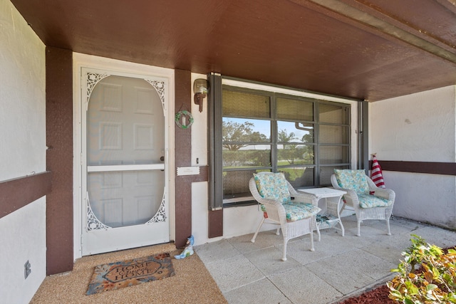 property entrance featuring stucco siding