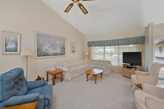 living area featuring a ceiling fan, high vaulted ceiling, and light carpet
