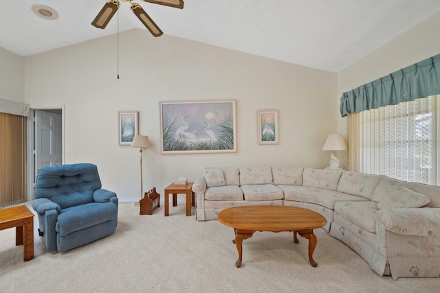 carpeted living room featuring vaulted ceiling and ceiling fan