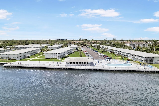 birds eye view of property featuring a water view