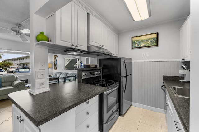 kitchen featuring light tile patterned floors, ceiling fan, stainless steel appliances, ornamental molding, and white cabinets