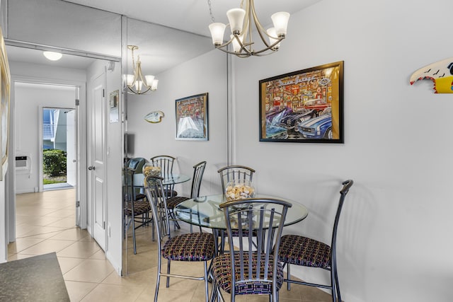 dining room featuring an inviting chandelier and light tile patterned flooring