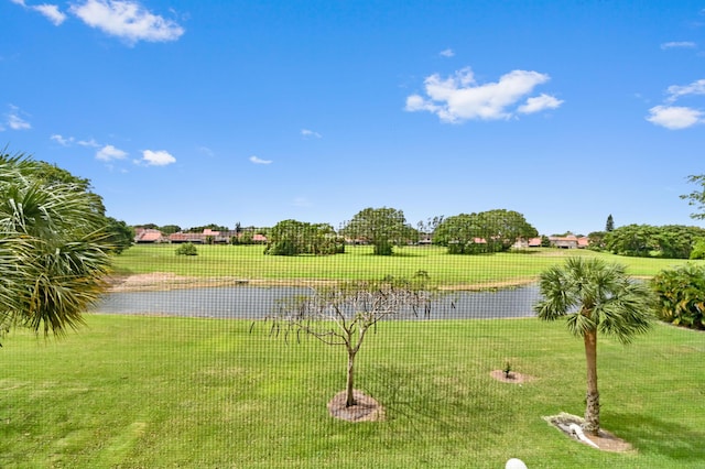 exterior space featuring a water view and a yard