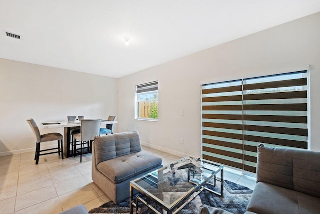 living room with light tile patterned floors