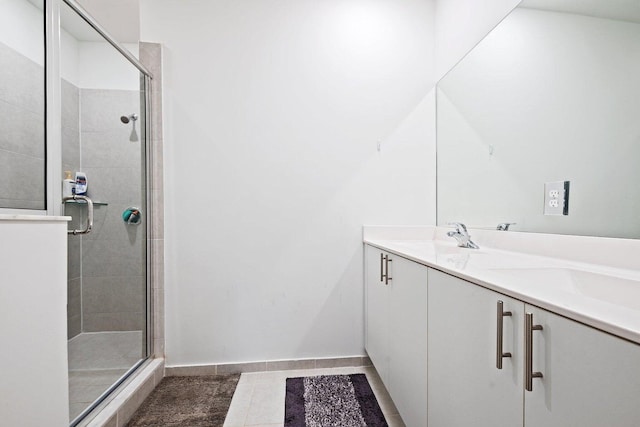 bathroom featuring vanity, an enclosed shower, and tile patterned flooring