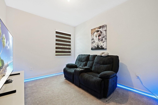 sitting room featuring light colored carpet