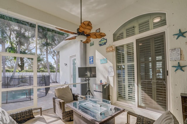 sunroom / solarium with ceiling fan