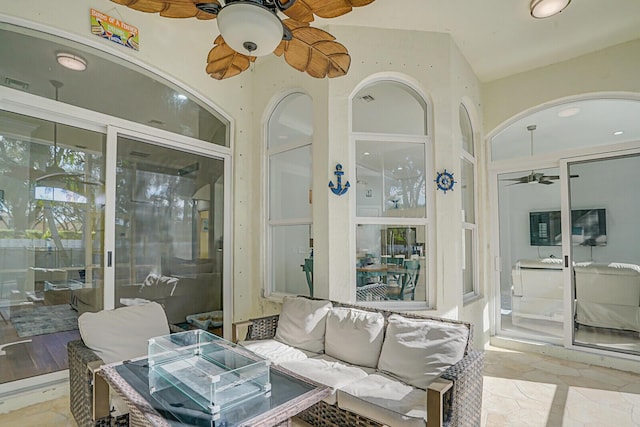 view of patio / terrace featuring ceiling fan and an outdoor living space