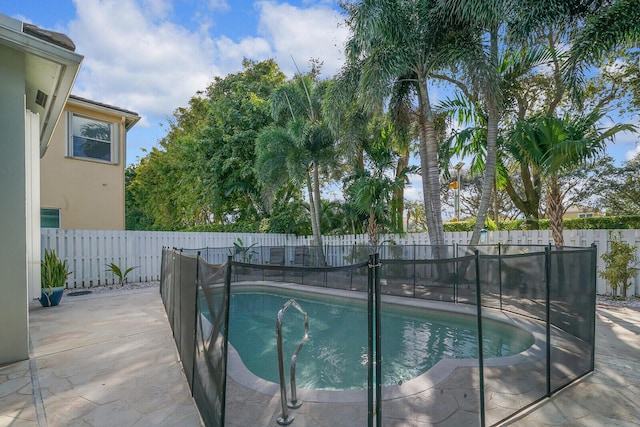 view of pool with a patio, a fenced backyard, and a fenced in pool