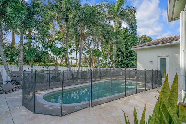 view of pool featuring a fenced in pool, a patio area, and a fenced backyard