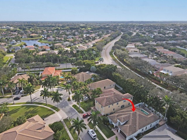 aerial view with a residential view and a water view