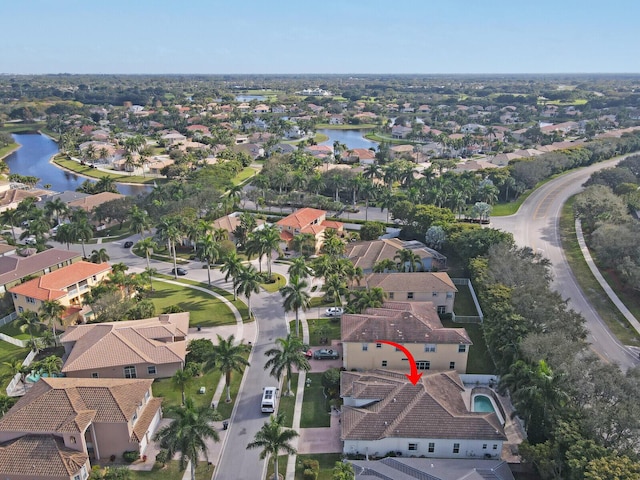 birds eye view of property featuring a water view and a residential view