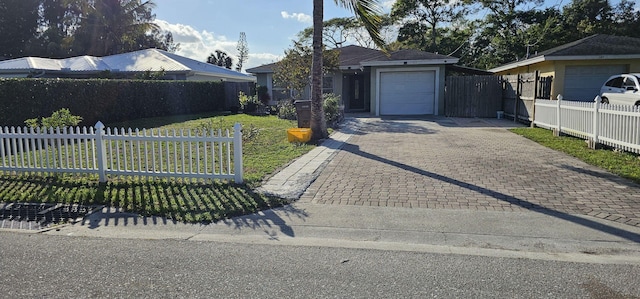 single story home featuring a garage