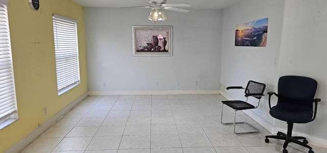 sitting room featuring ceiling fan and light tile patterned floors