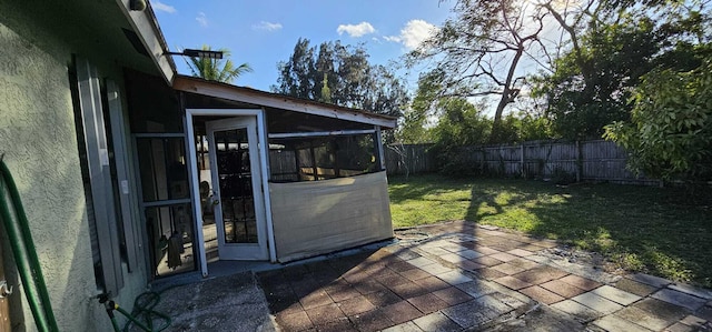 view of patio / terrace with a sunroom