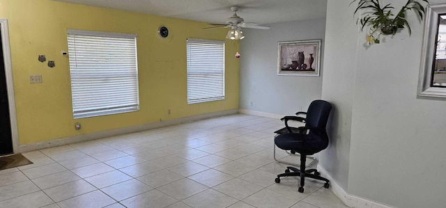 tiled office space with ceiling fan