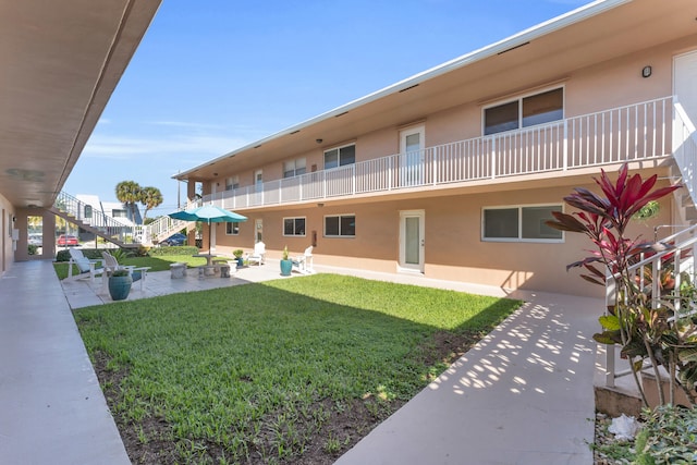 exterior space with a yard and a patio area