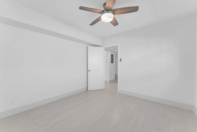 unfurnished room with ceiling fan