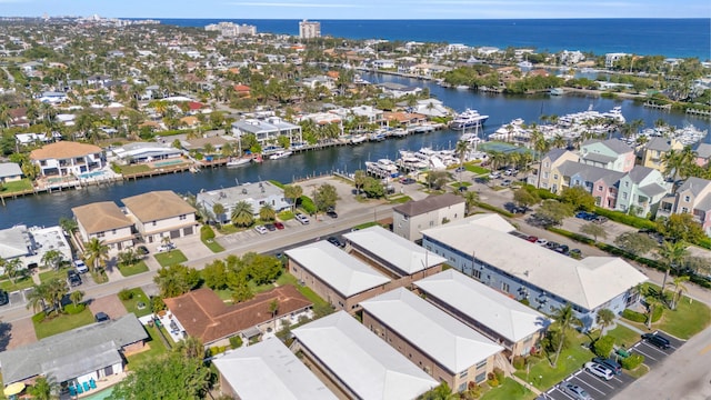 birds eye view of property featuring a water view