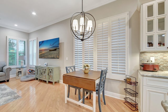 6718 Jog Palm Dr, Boynton Beach, FL 33437 - dining room featuring light wood-style floors, a chandelier, baseboards, crown molding, and recessed lighting