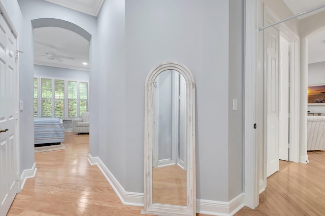 6718 Jog Palm Dr, Boynton Beach, FL 33437 - hall featuring arched walkways, light wood-style flooring, crown molding, and baseboards