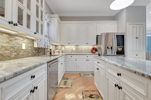 6718 Jog Palm Dr, Boynton Beach, FL 33437 - kitchen featuring stainless steel appliances, white cabinets, light stone countertops, glass insert cabinets, and tasteful backsplash