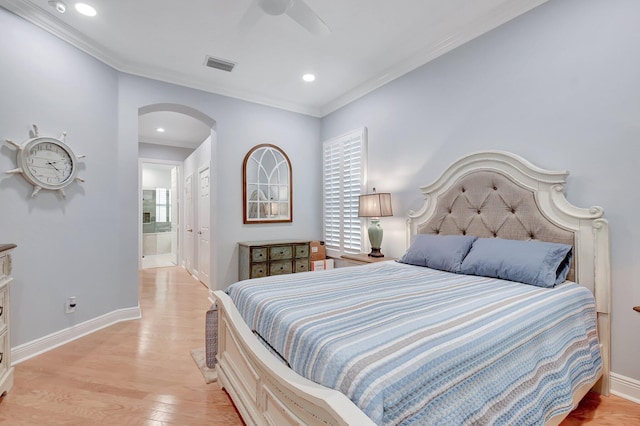 6718 Jog Palm Dr, Boynton Beach, FL 33437 - bedroom featuring arched walkways, ornamental molding, light wood-style flooring, baseboards, and ensuite bath