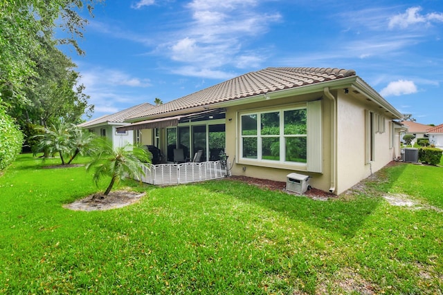 6718 Jog Palm Dr, Boynton Beach, FL 33437 - rear view of property with stucco siding, a lawn, and cooling unit