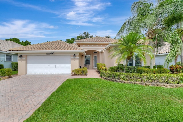 6718 Jog Palm Dr, Boynton Beach, FL 33437 - mediterranean / spanish home featuring stucco siding, a garage, decorative driveway, and a front lawn