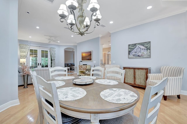 6718 Jog Palm Dr, Boynton Beach, FL 33437 - dining room with light wood-style floors, recessed lighting, french doors, arched walkways, and baseboards