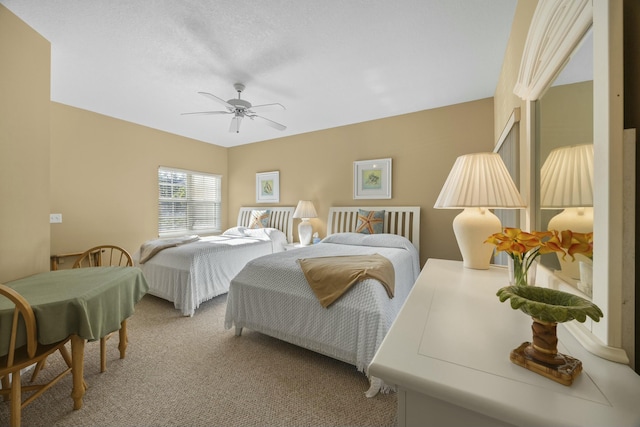 bedroom featuring ceiling fan and carpet flooring