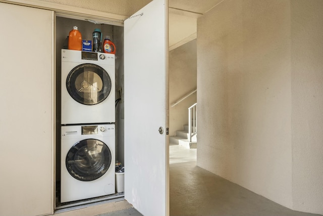 laundry area with stacked washer / dryer