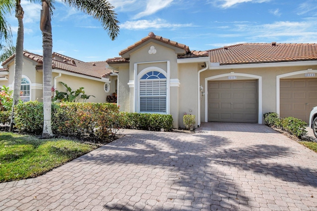 mediterranean / spanish-style home featuring a garage