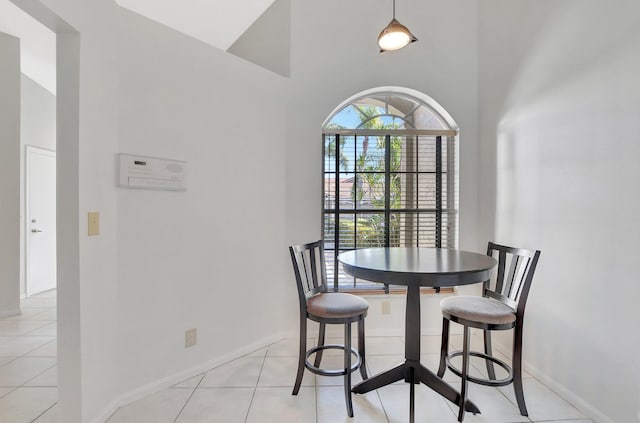 21117 Via Solano, Boca Raton, FL 33433 - dining room with vaulted ceiling, visible vents, baseboards, and light tile patterned floors