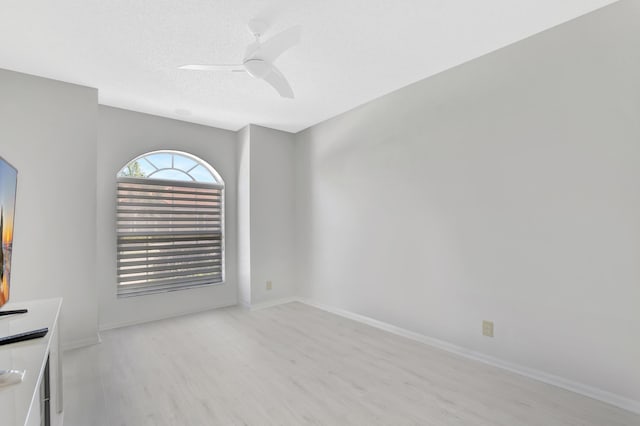 21117 Via Solano, Boca Raton, FL 33433 - spare room featuring baseboards, a ceiling fan, a textured ceiling, and light wood-type flooring