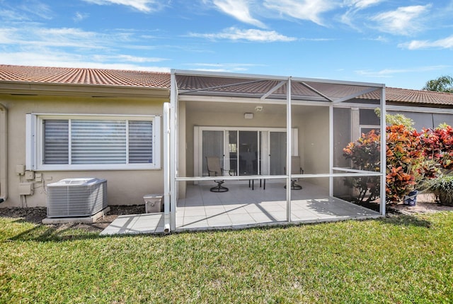 21117 Via Solano, Boca Raton, FL 33433 - rear view of house featuring a lawn, central AC, and stucco siding