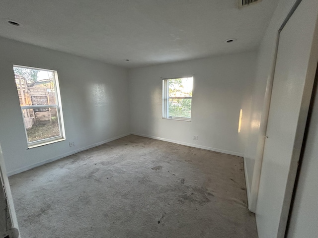 unfurnished room with light colored carpet