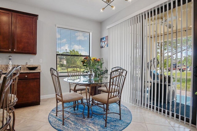 tiled dining room with plenty of natural light