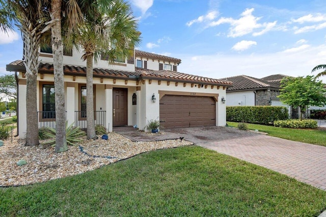 mediterranean / spanish home with a front yard