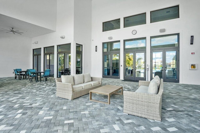 view of patio / terrace with an outdoor hangout area, french doors, and ceiling fan