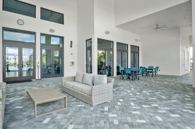 view of patio featuring french doors, ceiling fan, and an outdoor hangout area