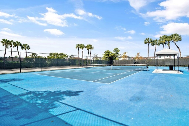 view of tennis court with a gazebo