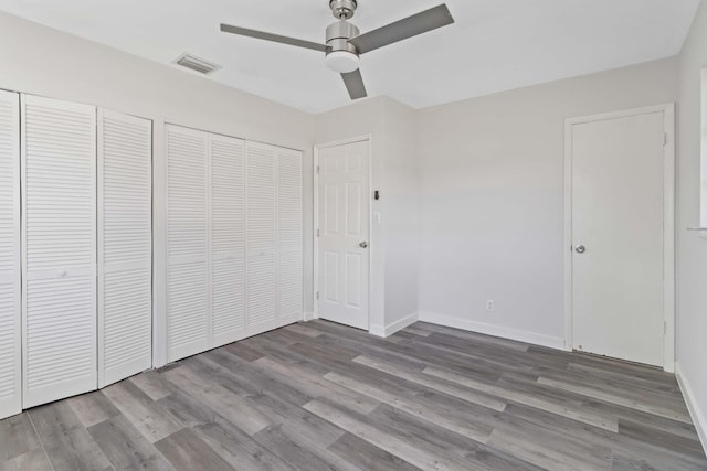 unfurnished bedroom featuring ceiling fan and light wood-type flooring