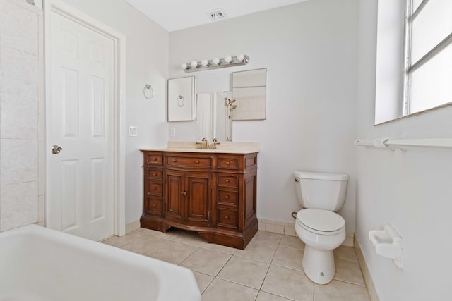 bathroom with vanity, a washtub, tile patterned floors, and toilet