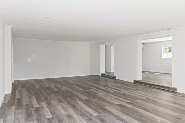 spare room with dark hardwood / wood-style flooring