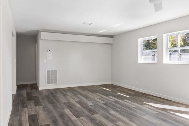 empty room featuring dark hardwood / wood-style flooring